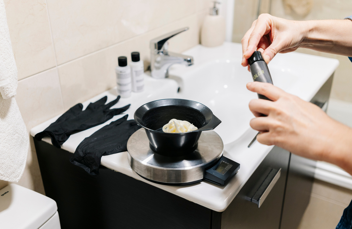 Putting Hair Dye in a Black Bowl