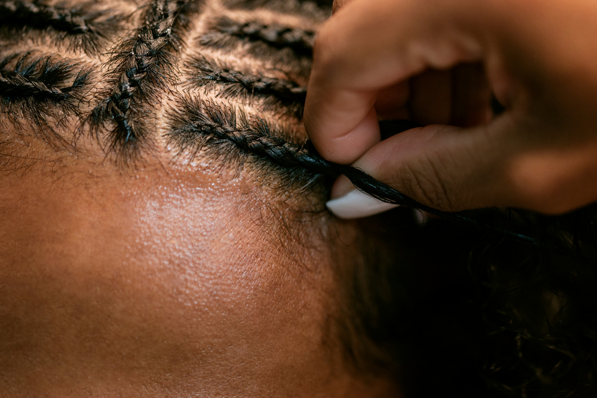 Man with Curly Hair Getting Braids