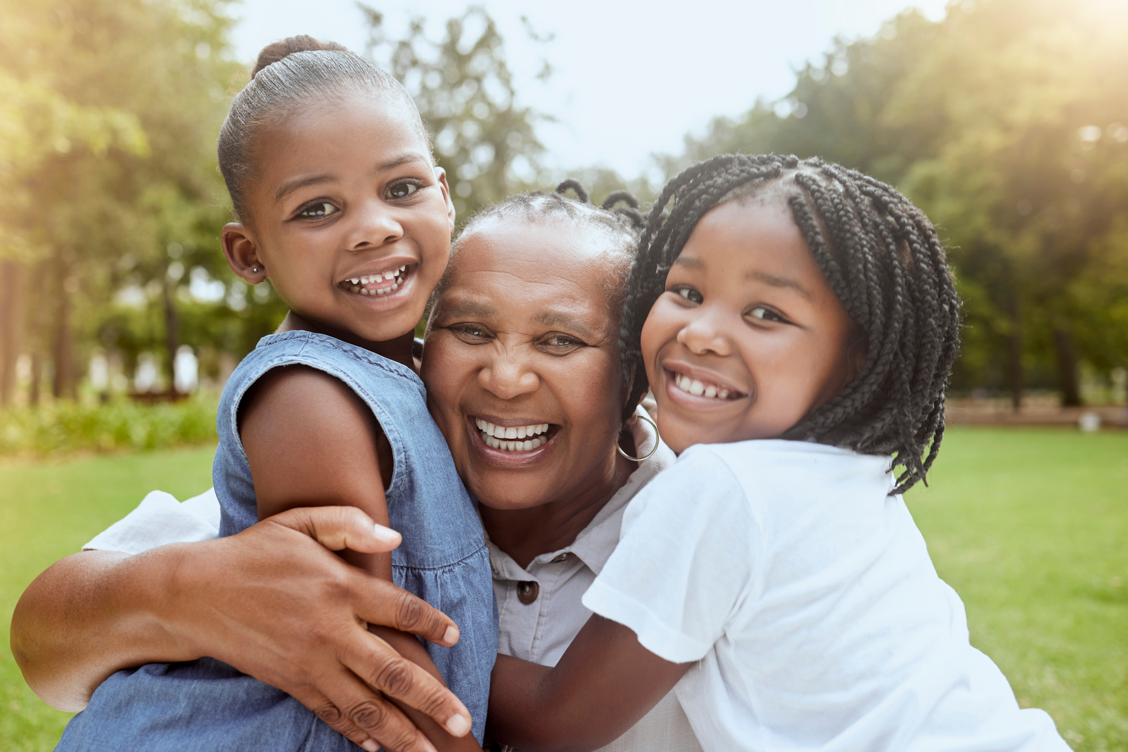 Little Girls with Their Grandmother Outdoors